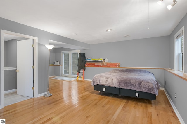 bedroom with light hardwood / wood-style flooring