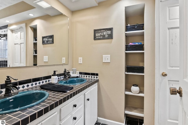 bathroom with vanity and tile patterned floors