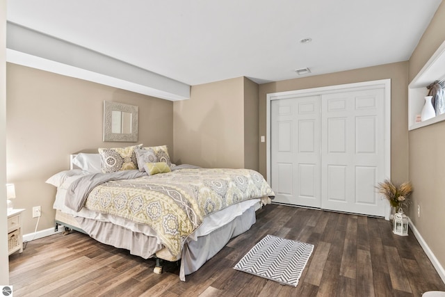 bedroom featuring hardwood / wood-style floors and a closet