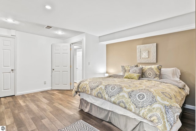 bedroom featuring wood-type flooring