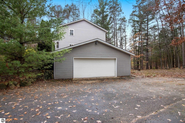 view of property exterior with a garage