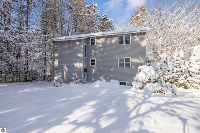 view of snow covered house