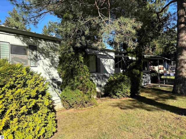 view of home's exterior featuring a yard