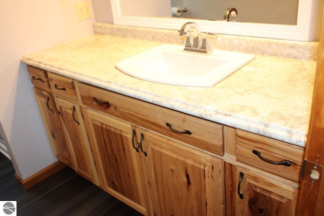 bathroom featuring vanity and hardwood / wood-style floors