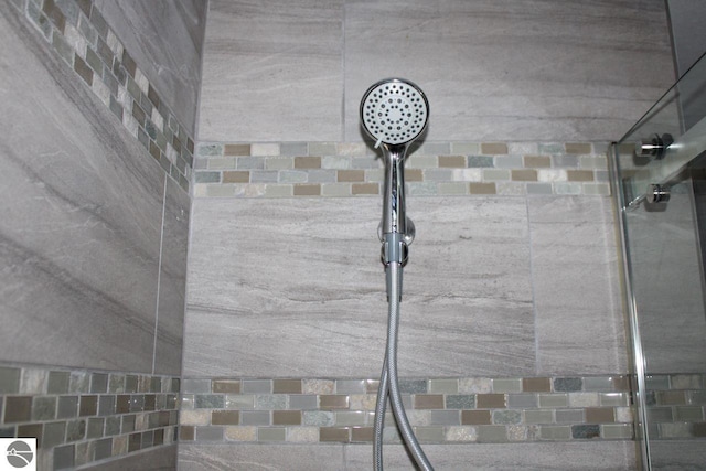 interior details featuring a shower