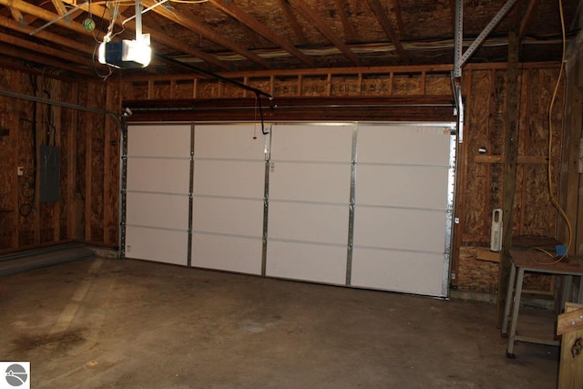 garage featuring a garage door opener and electric panel