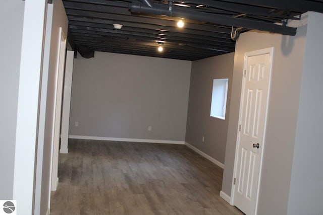 basement with hardwood / wood-style floors