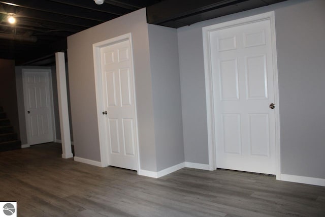 basement with hardwood / wood-style flooring