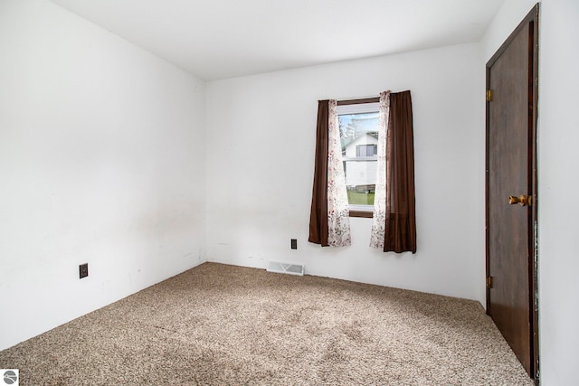 empty room featuring carpet floors