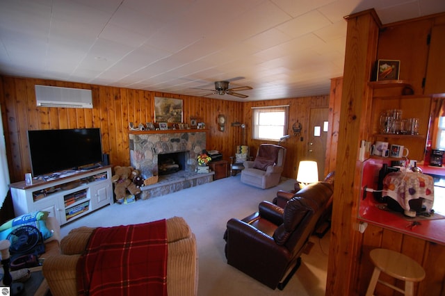 carpeted living room with wood walls, ceiling fan, a stone fireplace, and a wall mounted air conditioner