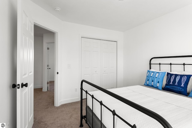 carpeted bedroom with a closet