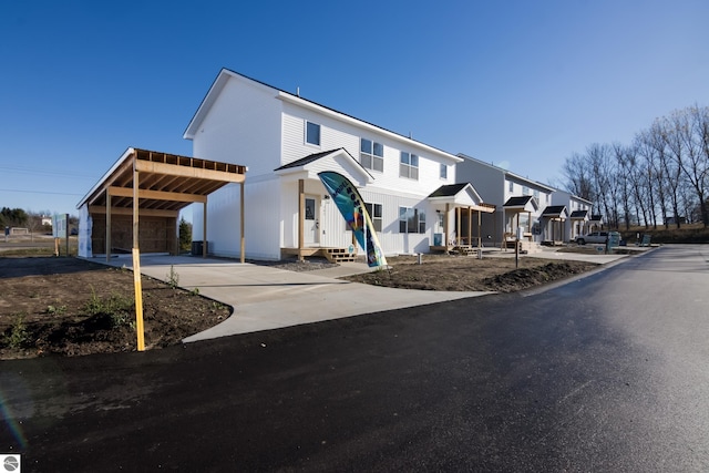 view of front of property with a carport