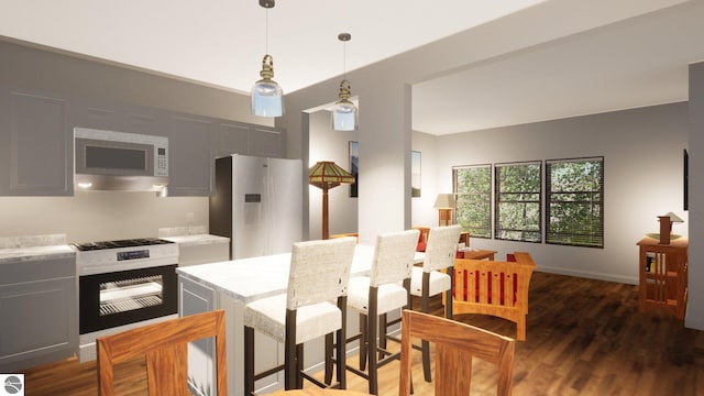 kitchen with decorative light fixtures, white refrigerator, stainless steel range with gas cooktop, dark hardwood / wood-style flooring, and wall oven