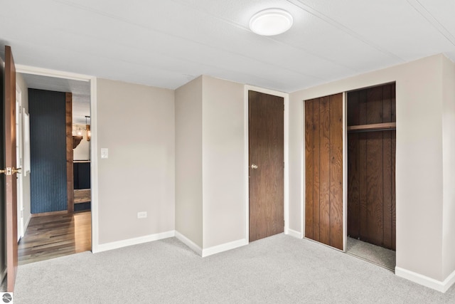 unfurnished bedroom featuring a closet and carpet floors