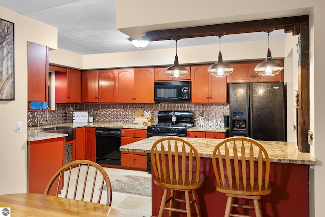 kitchen featuring sink, black appliances, light stone countertops, light tile patterned floors, and decorative backsplash