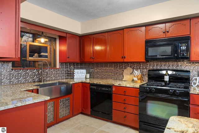 kitchen with black appliances, a textured ceiling, sink, tasteful backsplash, and light stone countertops