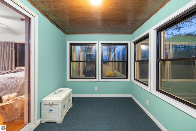 unfurnished sunroom featuring plenty of natural light and wood ceiling