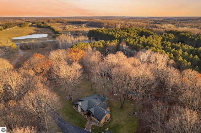 aerial view at dusk with a water view