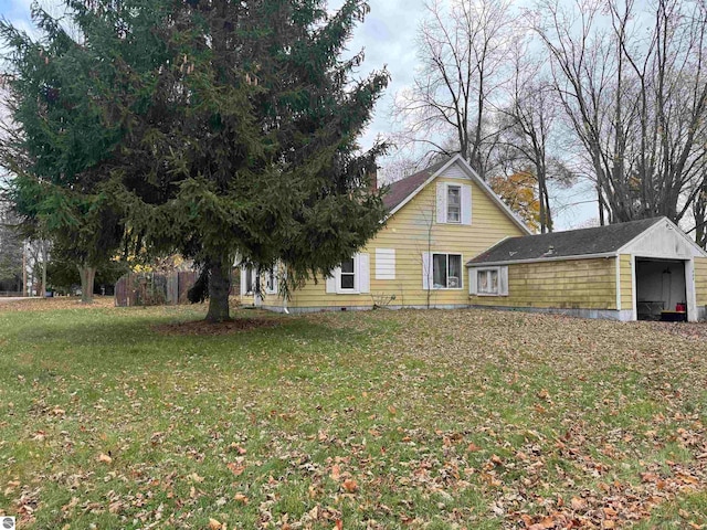 exterior space with a yard and a carport