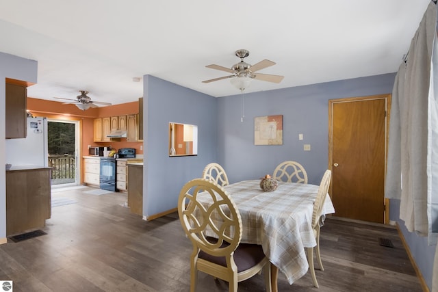 dining space with dark hardwood / wood-style flooring and ceiling fan