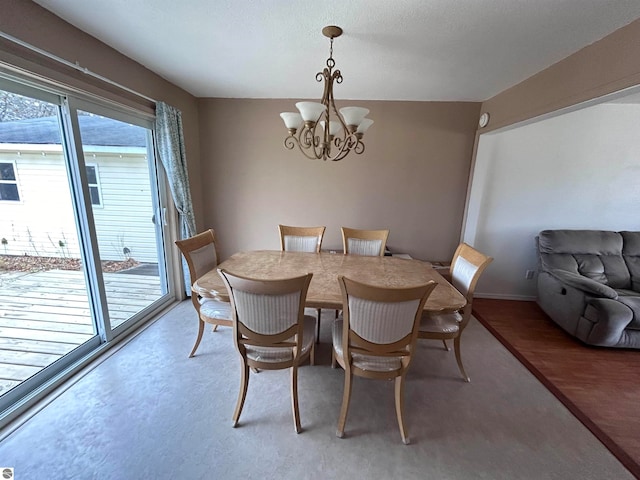 dining space featuring a chandelier and dark hardwood / wood-style flooring