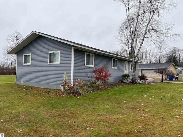 view of side of property with a yard