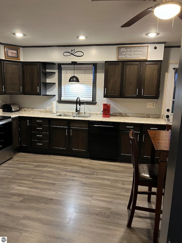 kitchen with dishwasher, stainless steel range with electric stovetop, sink, pendant lighting, and light wood-type flooring