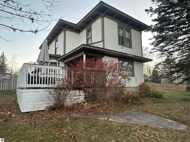 exterior space with a lawn and a deck