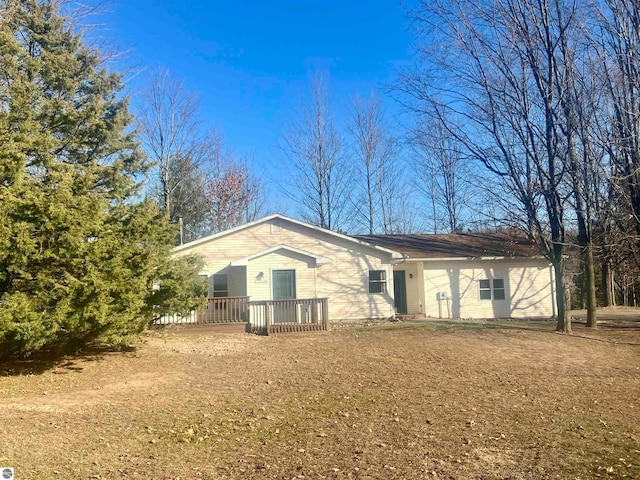 view of front of property with a wooden deck