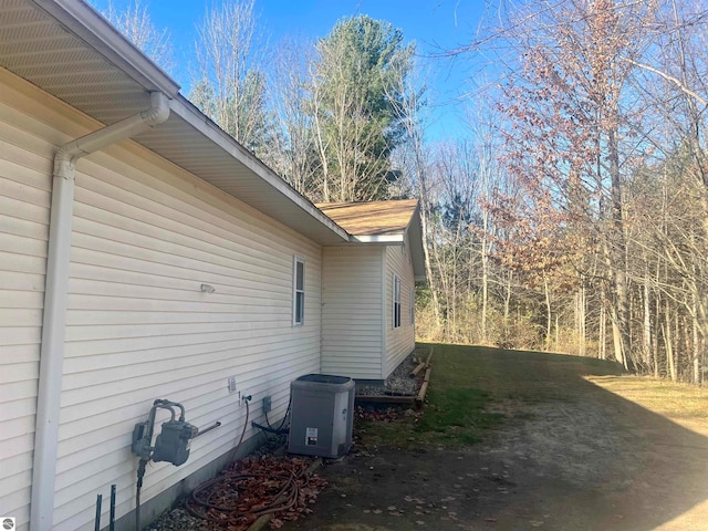 view of side of property with central AC unit