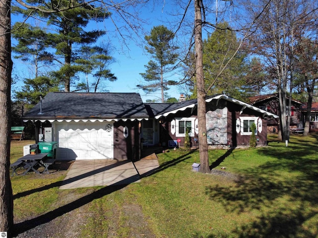 ranch-style home featuring a garage and a front yard