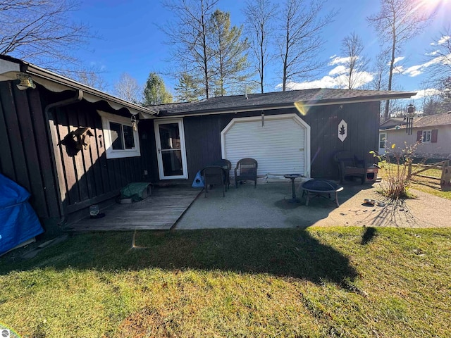 back of property with a patio and a yard