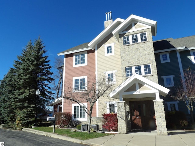 view of front of property featuring cooling unit