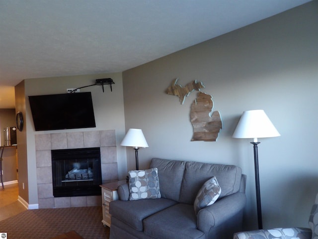 carpeted living room with a fireplace