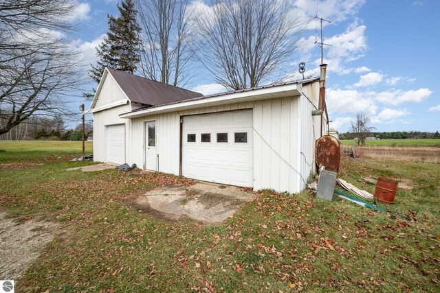 garage with a yard