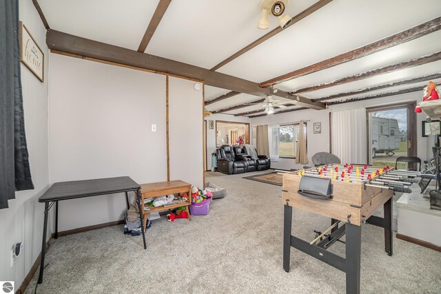 recreation room featuring carpet flooring, ceiling fan, and beam ceiling