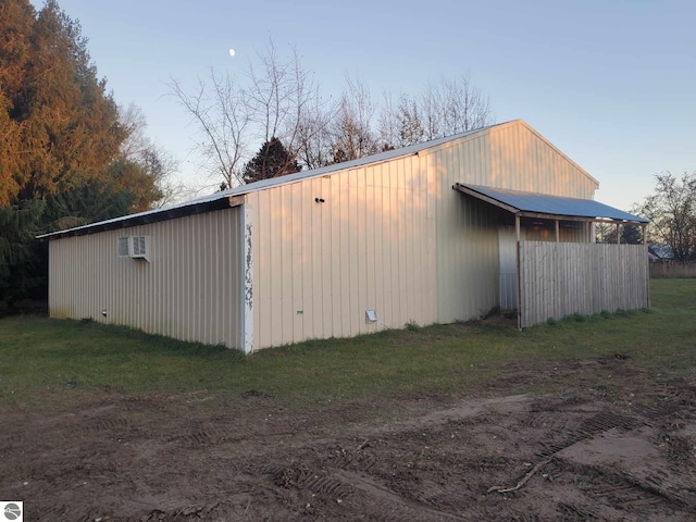 view of outbuilding with a lawn