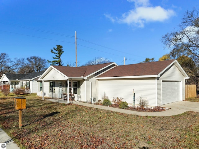 ranch-style home with a garage, a porch, and a front lawn