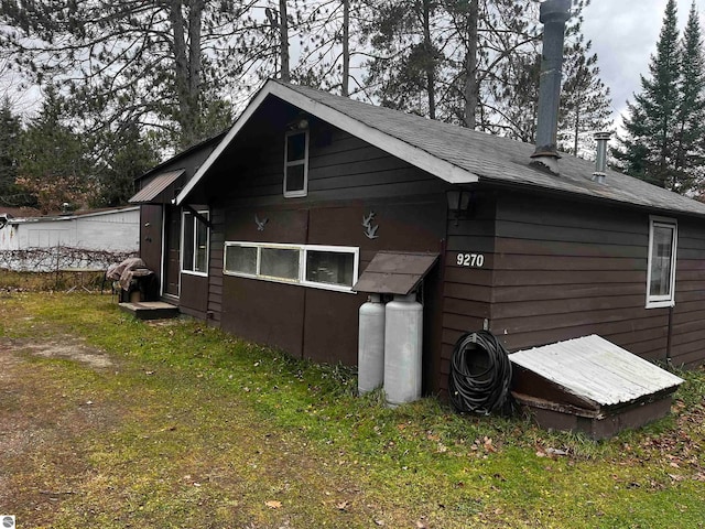 view of outbuilding featuring a yard