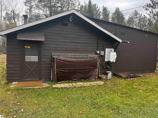 view of side of property with a lawn