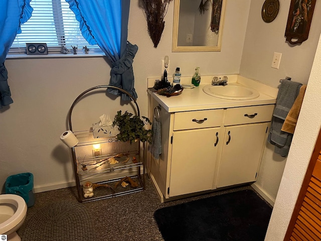 bathroom with vanity and toilet