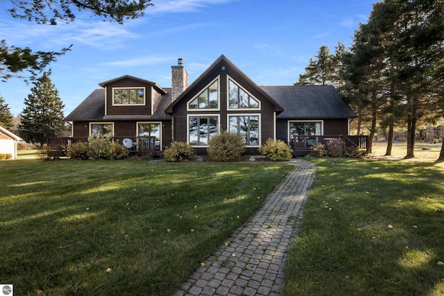 view of front of house featuring a front yard and a deck