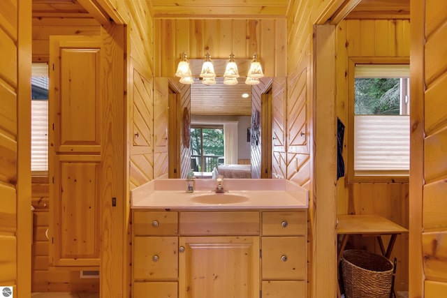 bathroom with wooden walls and vanity