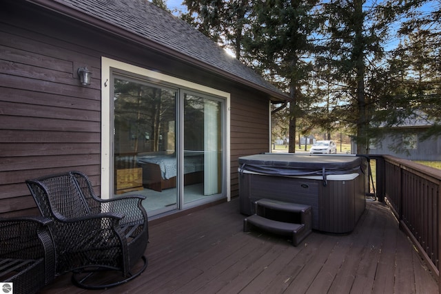 wooden terrace featuring a hot tub