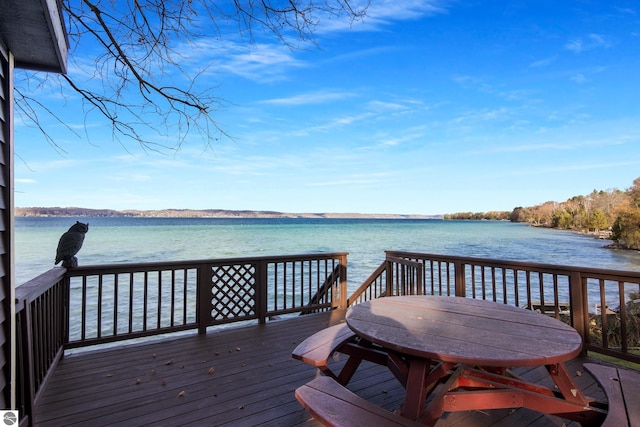 wooden deck with a water view