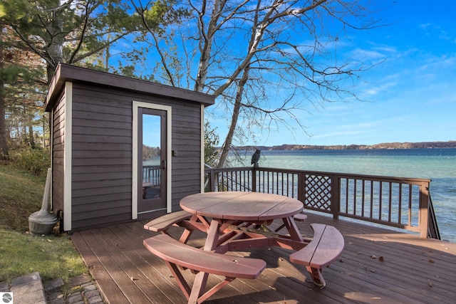 wooden deck featuring a water view