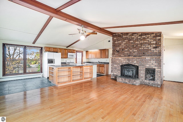 unfurnished living room featuring a fireplace, vaulted ceiling with beams, a baseboard heating unit, and light hardwood / wood-style floors