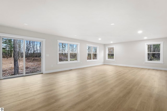 unfurnished living room with light wood-type flooring