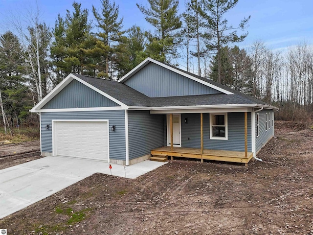 view of front of property featuring a porch and a garage