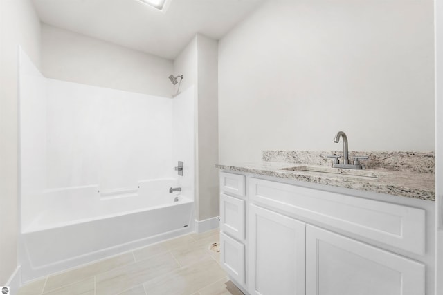 bathroom with vanity, tile patterned floors, and shower / bathtub combination